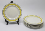 FAIANÇA -  Lote de 6 pratos de faiança nacional branca, decorados com faixas amarelas e frisos pretos. Dia. 18 cm. Leves bicados, fios de cabelo e marcas de uso.
