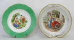 a) Prato de coleção em porcelana portuguesa com marca da manufatura Vista Alegre, tendo ao centro cena angelical com policromia. Diam. 24cm.b) Bowl em porcelana alemã, Bavaria, tendo ao centro cena com ninfas em policromia. Borda com vazados e frisos em dourado. Med. 5,5x23cm.