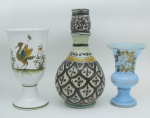 a) Dois pequenos vasos, sendo um em opalina na cor azul, com pintura de flores e folhas, e o outro em porcelana francesa com inscrição no verso Feret Moustiers. Alt. 12 e 15,5cm. b) Assinatura Ilegível - Floreira em cerâmica, possivelmente árabe, decorado com pintura em arabescos. Assinado na base. Alt. 19,5cm.