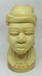 Escultura em marfim africano monobloco, representando "Busto de africana". Alt. 21cm.