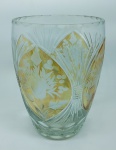 Vaso em cristal translucido com detalhes no tom âmbar, decorado com lapidações dedão, sulcos bisotados e flores e folhas em satiné. Alt. 23cm.