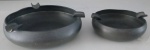 Dois cinzeiros em estanho marcado o GM X MG - Diâmetro: 10 cm e 9 cm- Lote com menor cinzeiro amassado.