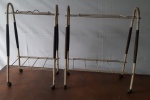 Mesinha para televisão/ telefone da década de 1970, estrutura em metal com pernas em madeira/ metal , prateleira na parte inferior e pés de rodinha.  - Medidas: 39x27x64 cm e 54x26x64 cm - lote com metal enferrujado no estado.