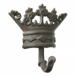 Cabideiro com gancho de ferro fundido para fixação em parede na forma de coroa.