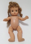 Antiga boneca em porcelana com olhos articulados, med.30 centímetros.