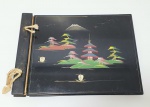 Antigo álbum japonês com capa e contracapa em madeira,  med. 37x26 centímetros.