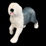 ESCULTURA EM PORCELANA INGLESA BESWICK, REPRESENTANDO CÃO. - MED 14 X 8,6 X 18 CM.