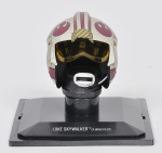 COLECIONISMO - STAR WARS - Miniatura de capacete de coleção francês da famosa série guerra nas estrelas em material sintético finamente policromado retratando Luke Skywalker. Med: 7 x 5cm