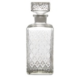 Garrafa para whisky de cristal europeu translucido e liso Formato quadrangular e tampa achatada. Séc. XX. 22 cm. Lote pertencente ao acervo de tradicional família paulistana de Américo Moreira dos Santos e Anella Mafalda Malzoni.