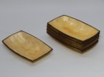 DIVERSOS, onze (11) covilhetes retangulares, ligeiramente abaulados, confeccionados em polímero com texturização nacarada, medindo 19 x 11 cm, borda em metal dourado.