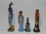ESCULTURAS, quatro (4) policromadas representando figura feminina: 2 em barro cozido, arte popular característica do vale do Jequitinhonha, uma delas com quebrados, colados e perdas, medindo a maior 17 cm altura; 2 representando afro descendente com trajes de inspiração tribal, confeccionadas em resina, uma delas com pescoço quebrado e colado, medindo a maior 22,5 cm altura.