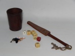 DIVERSOS, nove (9) itens: 1 copo, confeccionado em couro, medindo 10 cm altura; 7 dados diversos para jogos, confeccionados em materiais variados, cinco deles para jogo de poker; 1 rebenque em couro terminando em argola de bronze e corrente, medindo 31 cm comprimento, possui marca possessória a caneta esferográfica.