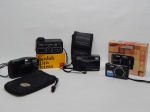 FOTOGRAFIA, quatro (4) câmeras fotográficas: 1 marca SAMSUNG, modelo ES68, 12.2 mega pixels, na caixa; 1 marca CANON, modelo SNAPPY LX, possui fôlder com instruções de uso; 1 marca OLYMPUS, modelo TRIP 100,  possui fôlder com instruções de uso no estado; 1 marca KODAK, modelo INSTAMATIC 11, dita tira teima, na caixa, possui fôlder com instruções de uso, todas usadas, não testadas e sem garantia.