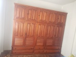 Guarda roupa duplex, madeira brasileira, 10 portas, 4 gavetões e 2 menores. Interior com prateleiras. Década de 90. 230 x 260 x 50cm.