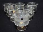 CRISTAL, seis (6) taças de pé baixo para coquetel de camarão, fuste cilíndrico, base em bolacha, quatro campanulas com bicadinhos na borda, uma das taças possui sinais de fungo, algumas com label da manufatura CRISTAIS HERING, medindo 11 cm altura.