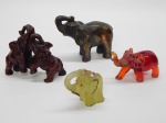 ESCULTURAS, quatro (4) elefantes, confeccionados em resina ou símile, medindo o maior 11 cm.