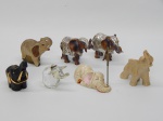 ESCULTURAS, sete (7) elefantes, confeccionados em materiais diversos, alguns com pequenos defeitos e perdas, medindo o maior 7 cm.