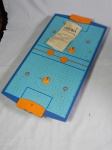 DISCOBOL - Jogo de hóquei movido a ar, composto de tabuleiro, 2 discos e 2 rebatedores.  Manufatura de Brinquedos Estrela. Funcionamento desconhecido e com faltas. 10 x 83 x 43cm.