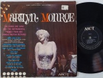 Marilyn Monroe  The Songs She Sang And The Instrumental Themes From Her Famous Motion Pictures. LP Original americano 60's. Disco em bom estado , com riscos superficiais. Capa em bom estado com manchas amareladas pelo tempo.