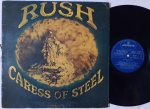 Rush  Caress Of Steel LP Brasil Gatefoild 1975 Muito bom estado. Rara Primeira Edição Brasileira Pela Mercury selo azul 70's. Disco em muito bom estado. Capa em bom estado com amassos discretos e desgastes acentuados na espinha da capa.