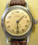 VUKA (Incabloc) - Elegante e antigo relógio de pulso suíço, automático, com caixa em aço e pulseira em couro. Med 3,5 cm. Obs: No estado.