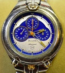 BULOVA (Chronograph) - Elegante e raro relógio de pulso suíço, modelo esportivo para mergulho 100m, a quartz, com caixa e pulseira em aço . Funcionando no momento. Med.: 3,5 cm.