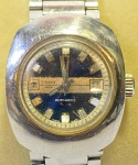 TISSOT (T-12) - Elegante e raro relógio de pulso suíço, modelo feminino  automático, com caixa e pulseira em aço. Funcionando no momento. Med 3 cm.