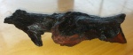 Fóssil de madeira nobre com formato que lembra um delfim ou água. Perfeita para decoração de ambientes. mede 24x 10cm de altura.