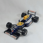 Williams FW14 - Fórmula 1 F1 temporada 1991 - Piloto Nigel Mansell. Carro em miniatura diecast com partes em plástico injetado fabricado pela Bburago na escala 1/24,. As rodas giram livremente e os pneus são de borracha.