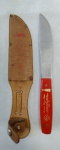 CUTELARIA - ( FACA CORTESIA ) BEBIDAS ITAJAI LTDA  COMPRIMENTO TOTAL 19,6 cm ACOMPANHA BAINHA ORIGINAL EM COURO / FACA TRAMONTINA