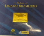 COLEÇÃO LEGADO BRASILEIRO  " SELO-LINGOTE " EM BRONZE E BANHADO A OURO 24 QUILATES ... DIMENSÃO DA PEÇA 2,7 x 3,8 cm  TEMA " PROPAGANDA TURÍSTICA - CATARATAS DO IGUAÇU "