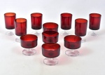 Conjunto de taças vermelhas sobre haste e pé circular incolor. Fundo marcado France. Contendo: 6 taças para vinho e 5 taças para champanhe. Total 11 pçs