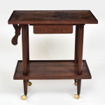 Bar em folha de jacaranda com dois estágios, anos 70 ao gosto Zanine. Pernas torneadas lisas sobre rodízios. Gaveta faca (abre p/ 2 lados) e alça articulada (invisível). Tampo 67x46 cm   Altura 69 cm