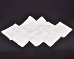 Conjunto de 12 guardanapos de tecido branco ,destaca-se por bordados em linhas de ceda. 45x45 cm. Discretas manchas amareladas.