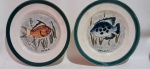 Pratos de coleção em cerâmica Prado com pintura artesanal peixe Piranha e peixe  Barbeira. Medida diâmetro 24 cm de diâmetro e 25 cm de diâmetro.