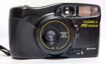 ANTIGA CÂMERA YASHICA - Kyocera - MG-motor - Na caixa - 35mm . Possui certificado de garantia e manual de instrução - Funciona com duas pilhas pequenas - Motor funcionando; Disparando e rebobinando. Porém precisa de revisão no flash. Medida da caixa: 14 x 9 x 8 cm.