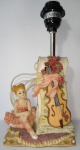 ABAJUR -  Belíssimo abajur feito em Biscuit, com bailarina sentada ao lado de Violoncelo,  notas  musicais e florais.Medindo: 29 X 14 X 11 cm.