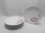Jogo de 6 pratos rasos em porcelana Schmidt floral com friso prata. Medindo 25,5cm de diâmetro.