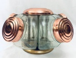 Antigo baleiro giratório, com cinco compartimentos em vidro com tampas em cobre. Med. Alt. 27 cm. Diâm. 44 cm.