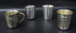 DIVERSOS - Quatro  (4) copos infantis  em metal espessurado a prata  de manufaturas diversas. Medidas: maior 7 cm de altura / menor 6,4 cm de altura. com sinais de oxidação.