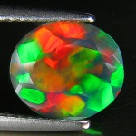 Rara Opala black multi colorida de excelente qualidade e clareza , clássica lapidação oval brilhante pesando 1.54 cts medindo 9.47 x 8.40 x 4.43 mm . ótimo investimento para montar uma joia de qualidade . origem Etiópia .