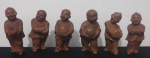 Lote constando seis esculturinhas orientais em madeira (roseira) representando 6 dos 7 "Budas da Sorte". Med.: 8 cm. Obs.: Dois deles com perda de fragmento nos pés