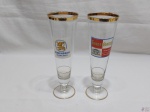 Par de tulipas em cristal com propagandas de cerveja e friso ouro. Medindo 22cm de altura
