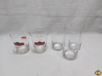 Lote composto de 5 copos diversos em vidro, sendo 3 longos e 2 de whisky. Medindo os copos longos 14,5cm de altura.