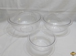 Jogo de 3 bowls em acrílicos incolor. Medindo o maior 25cm de diâmetro x 15cm de altura.