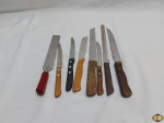 Lote de 8 facas de servir diversas.
