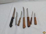 Lote de 7 facas de servir diversas.