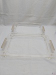 Par de suportes em acrílico para travessas. Medindo o suporte maior 49cm x 28cm x 6cm de altura.