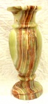 Vaso em mármore ônix,                                                                                                                       com rajadas marrom. Altura 38 cm.                                                                                                   (Pequeno quebrado na borda)