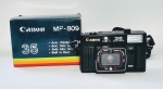 Câmera Fotográfica - CANON 35 Auto Wind MF 809 - Made In Japan - Na caixa original - Em ótimo estado de conservação, Necessita de reparo em uma das molas das pilhas. Medida: 13 z 8 x 6 cm.